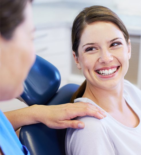 woman talking to her dentist